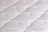 silk comforter detail spread out